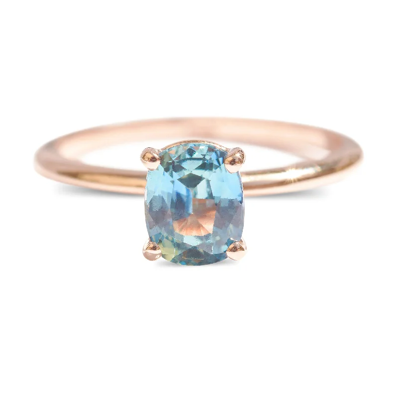 Women’s engagement rings with halo diamonds-Cushion cut teal sapphire engagement ring in rose gold